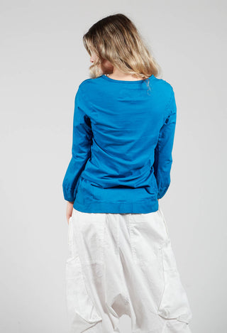 Round Neck Long Sleeved T Shirt with Bell Sleeves in Blue