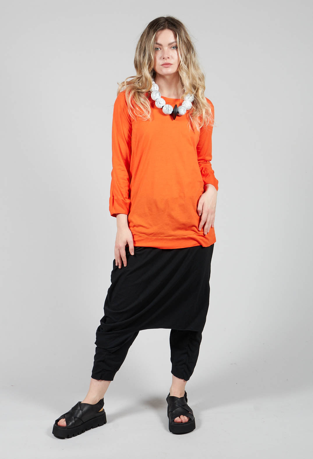 Round Neck Long Sleeved T Shirt with Bell Sleeves in Orange