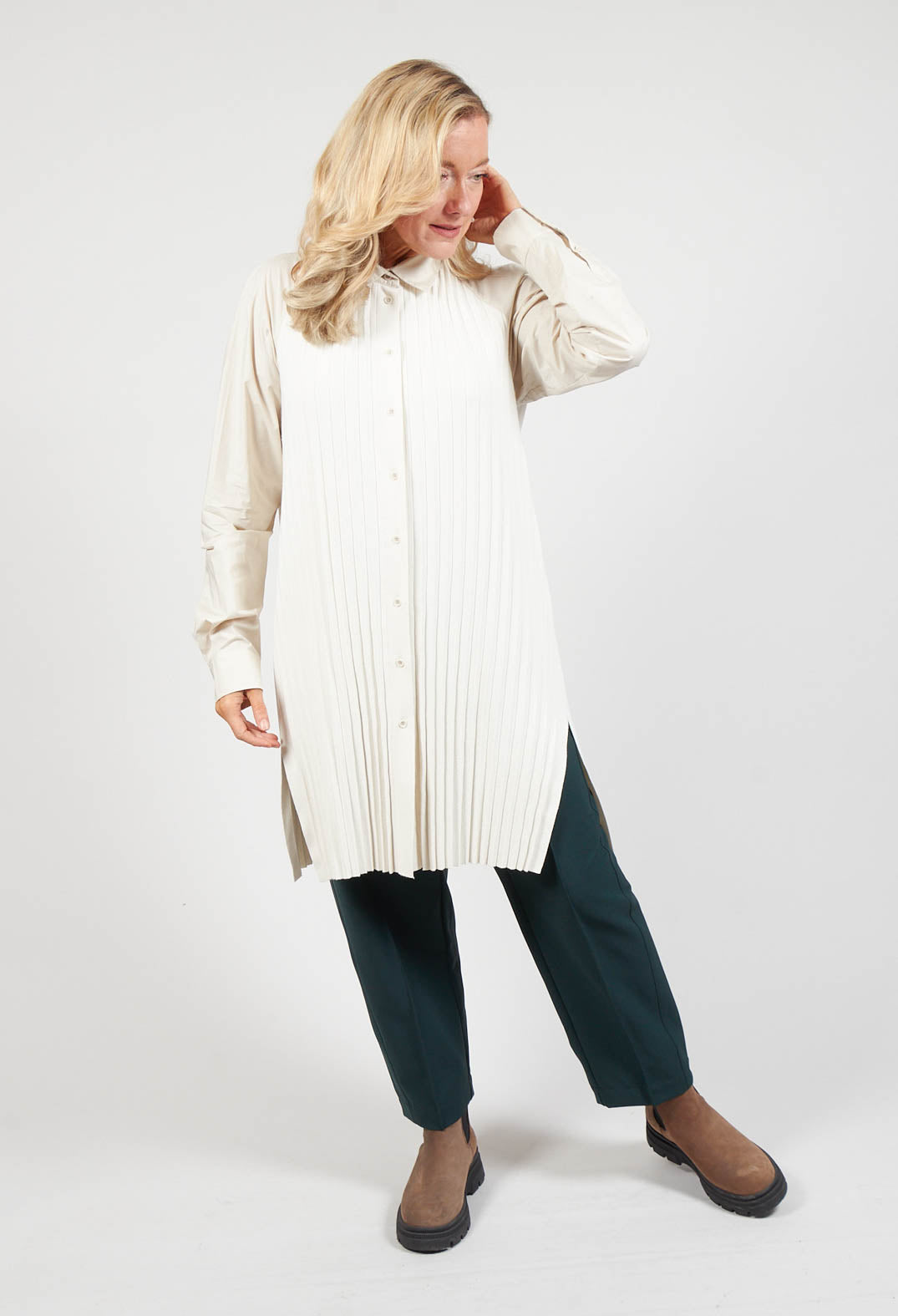 lady wearing a pretty blouse in cream