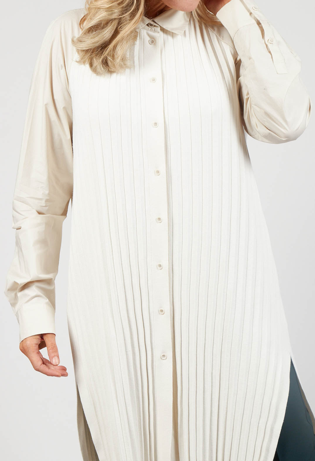 close up of ladies cream buttoned blouse