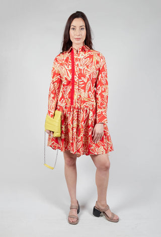 lady wearing long sleeved shirt dress in leo print