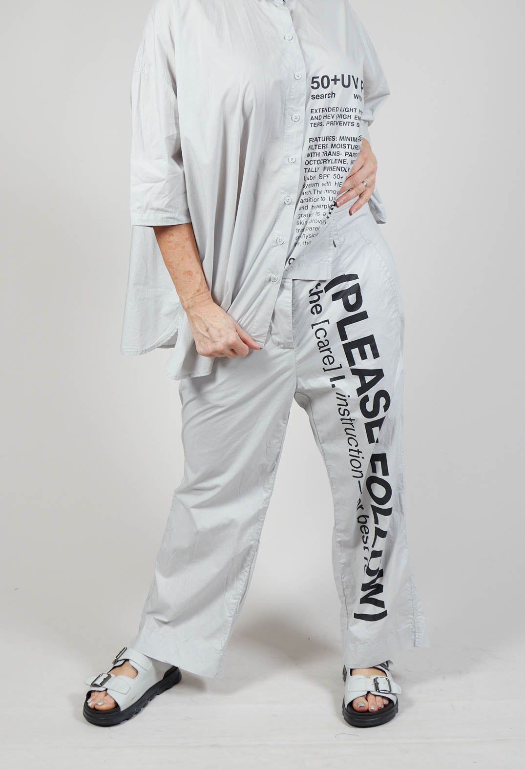 Wide Leg Trousers with Lettering Motif in Grey Print