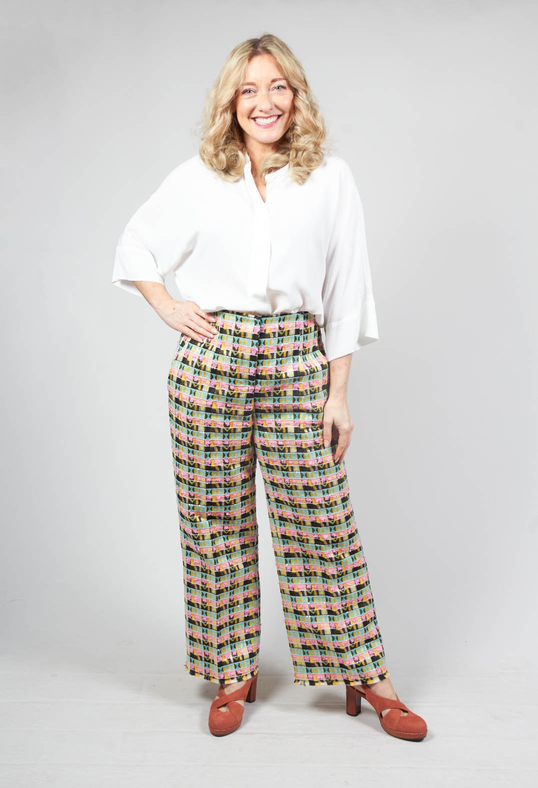 happy lady wearing wide leg trousers in black multicolour