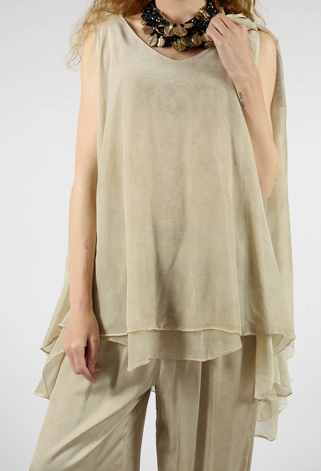 Asymmetrical Sheer Finish Top in Gold