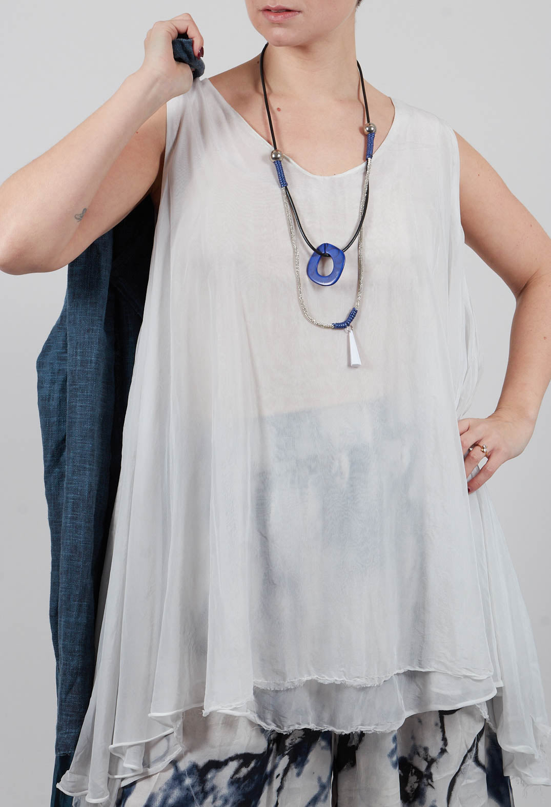 Asymmetrical Sheer Finish Top in Ice