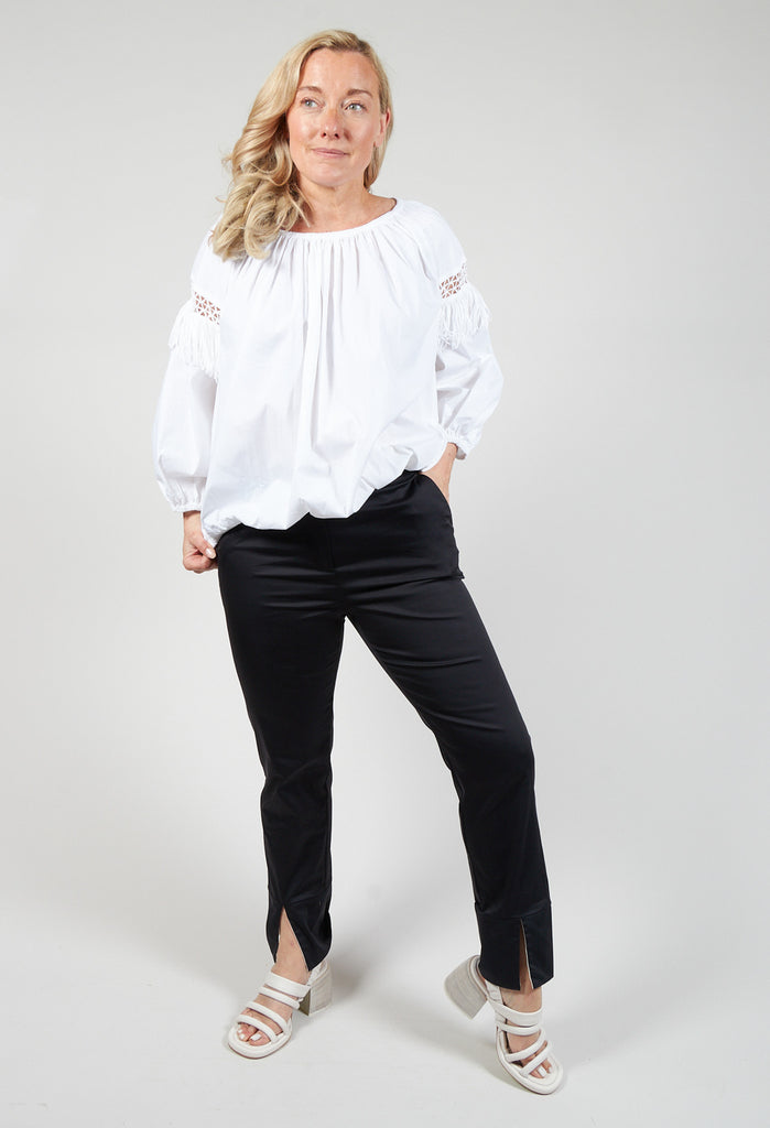 lady smiling wearing some black tailored trousers