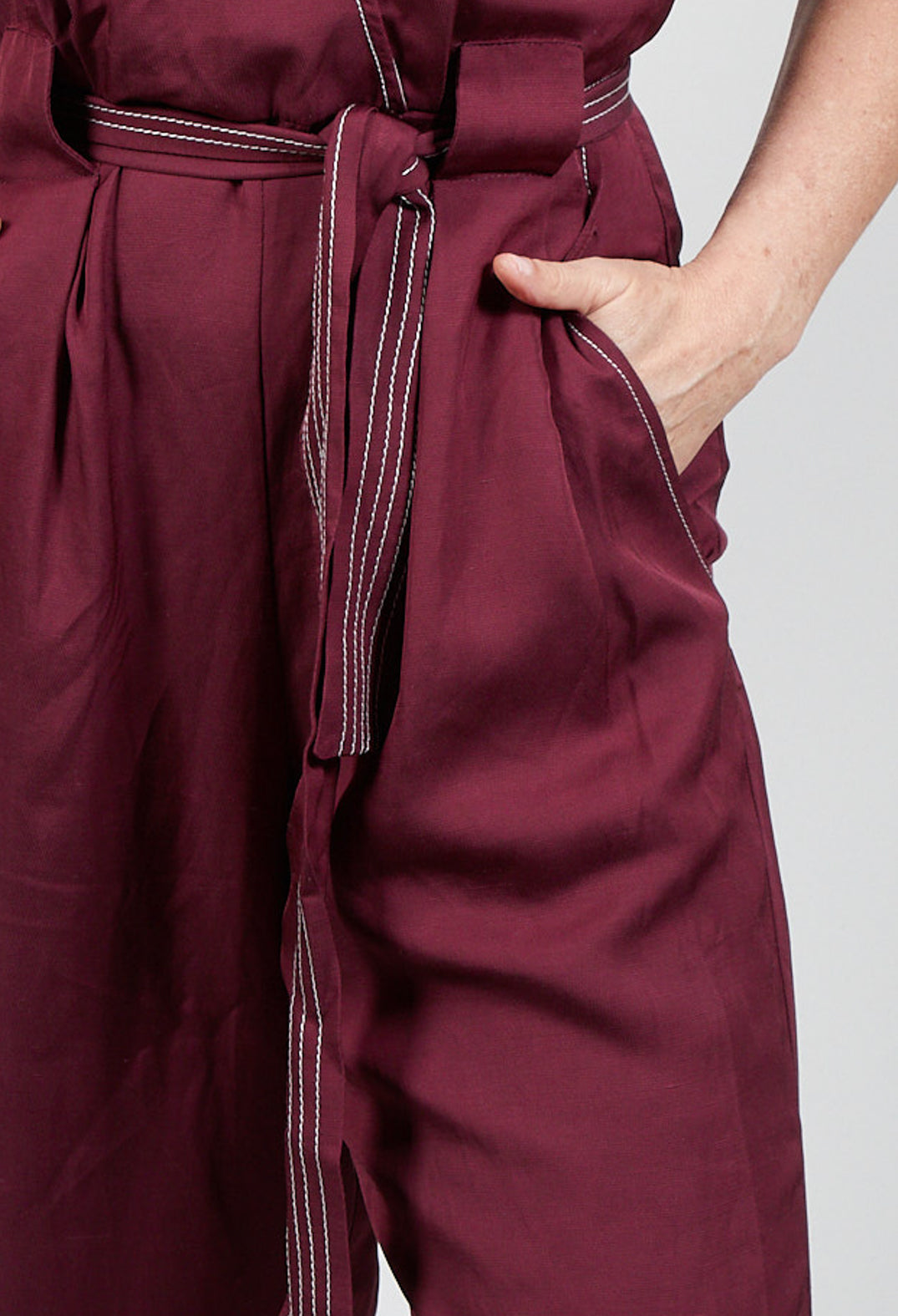 burgundy jumpsuit pocket and tie waist belt
