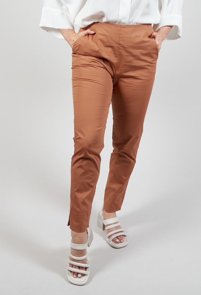 brown tapered trousers with front pockets