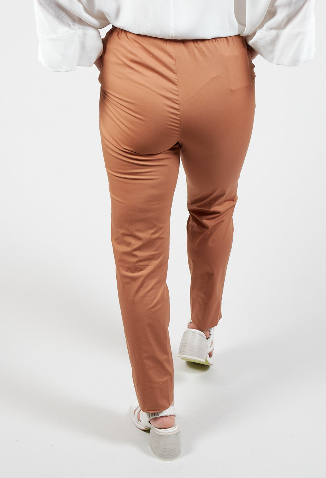 behind shot of tapered brown trousers