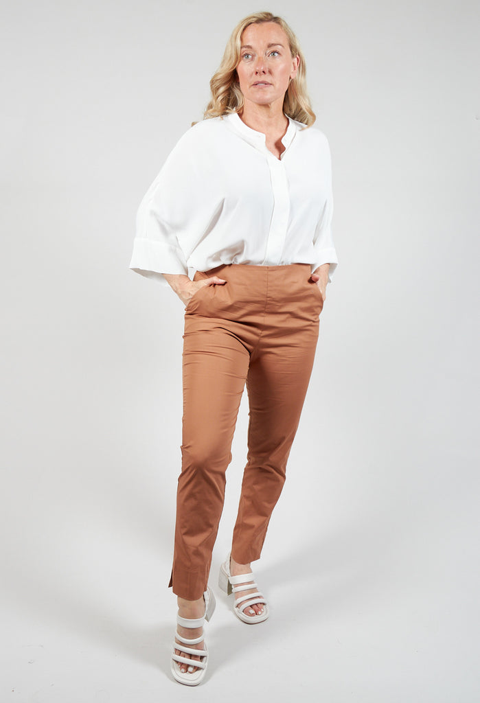 lady wearing tapered brown trousers