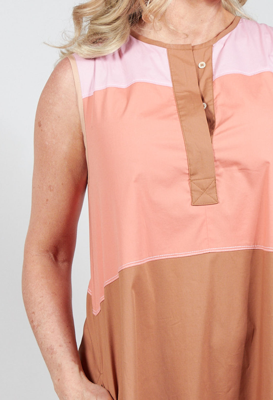 light brown shift dress with button fastening at the neck