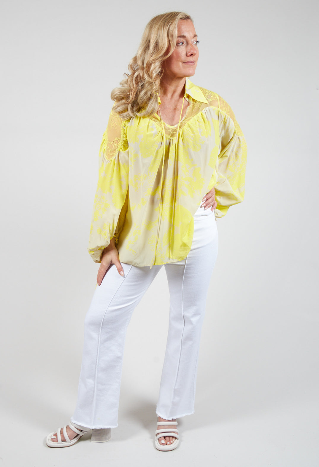 lady wearing our cream lace detail blouse 