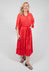 red tiered maxi dress with tie waist belt and mid length sleeves