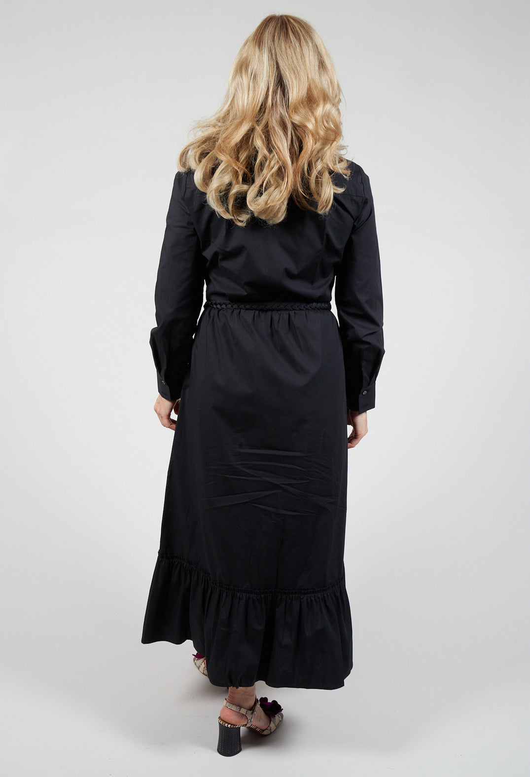 lady wearing a black shirt dress