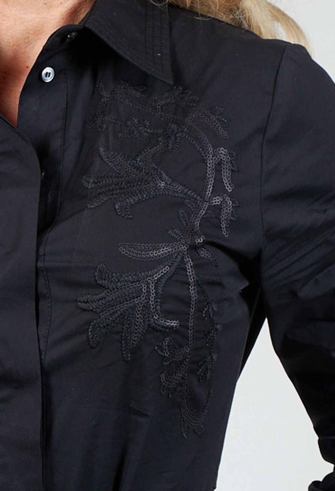 sequin embroidery on a black shirt dress