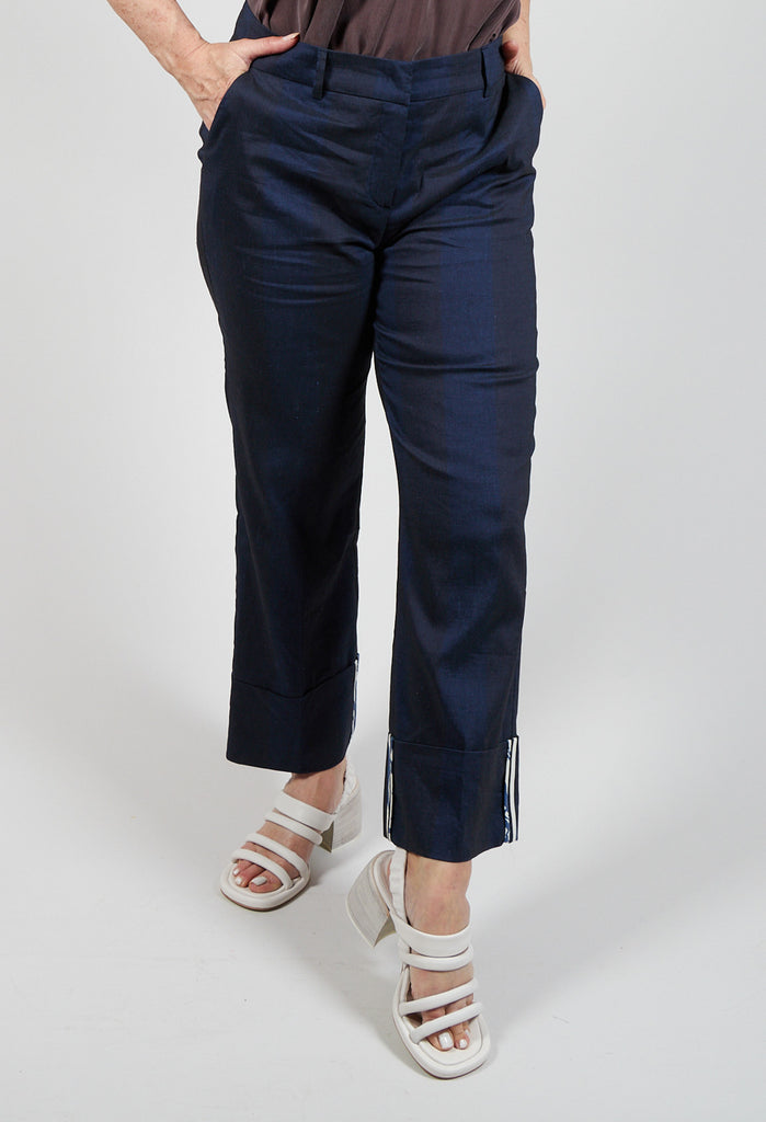 lady wearing blue striped turn up trousers