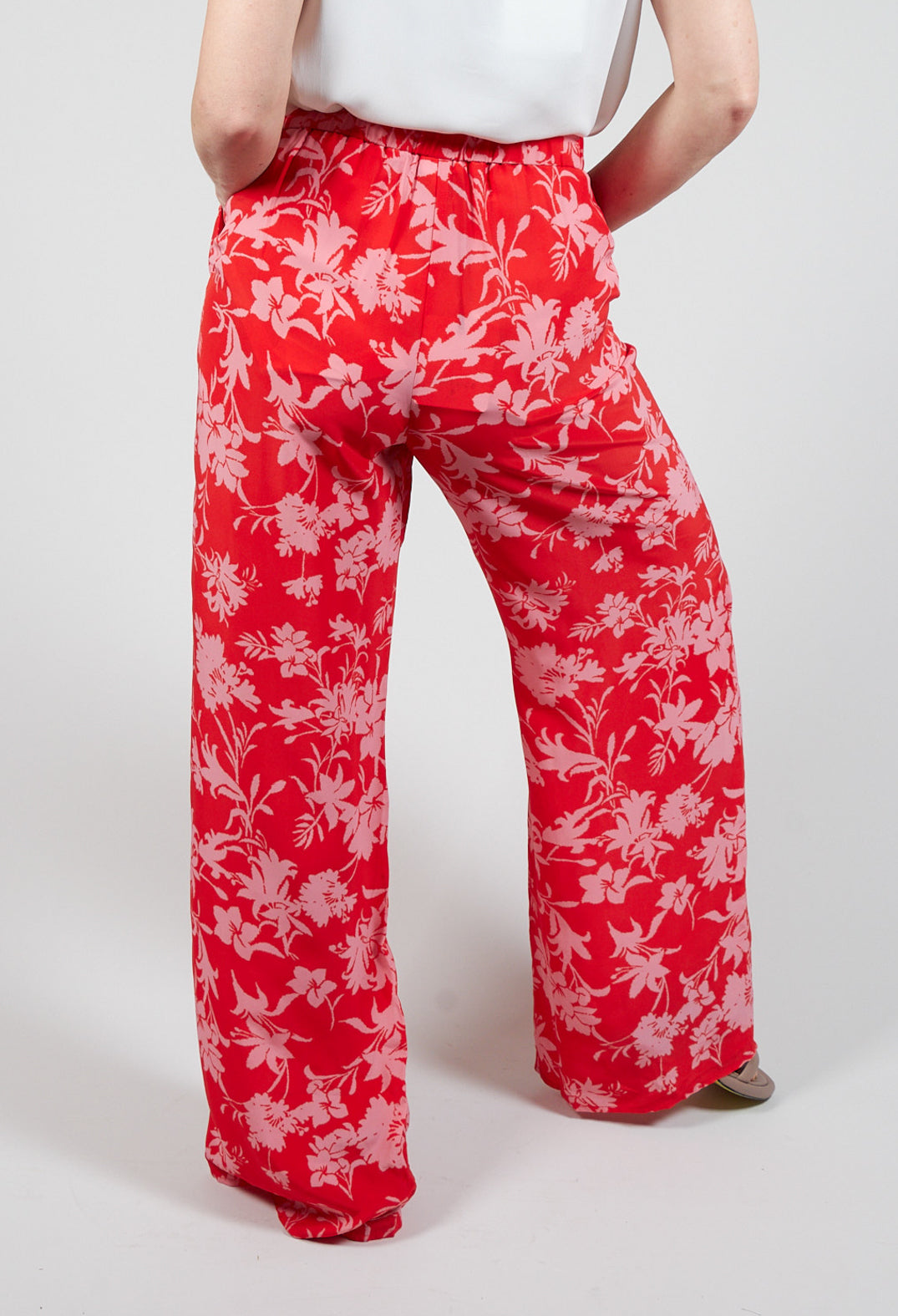 red wide leg floral print trousers with front pockets