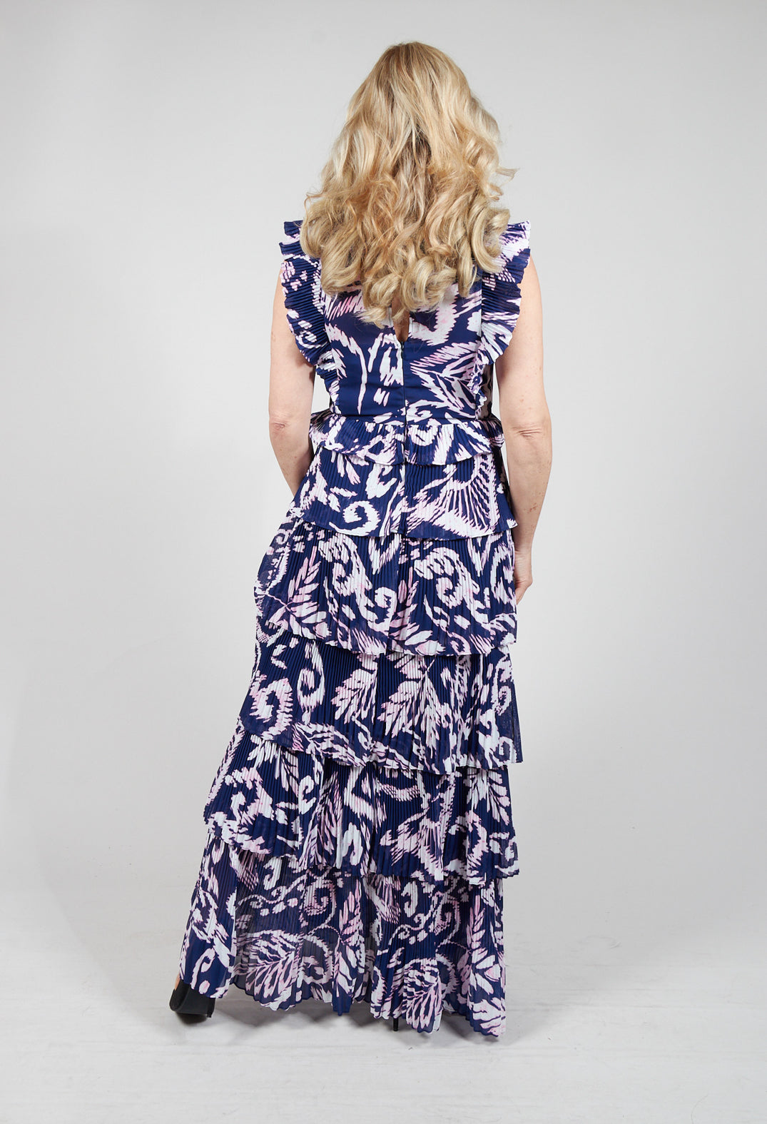 lady wearing a long tiered printed dress