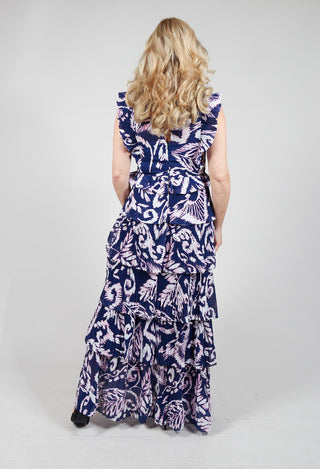 lady wearing a long tiered printed dress