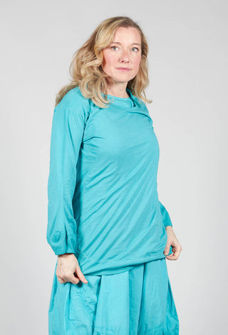 Round Neck Long Sleeved T Shirt with Bell Sleeves in Aqua