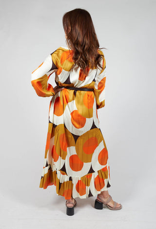 lady wearing a long sleeve maxi dress in circle print