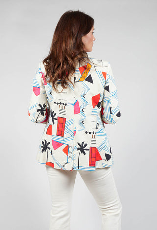 behind shot of lady wearing a jacket in matisse print