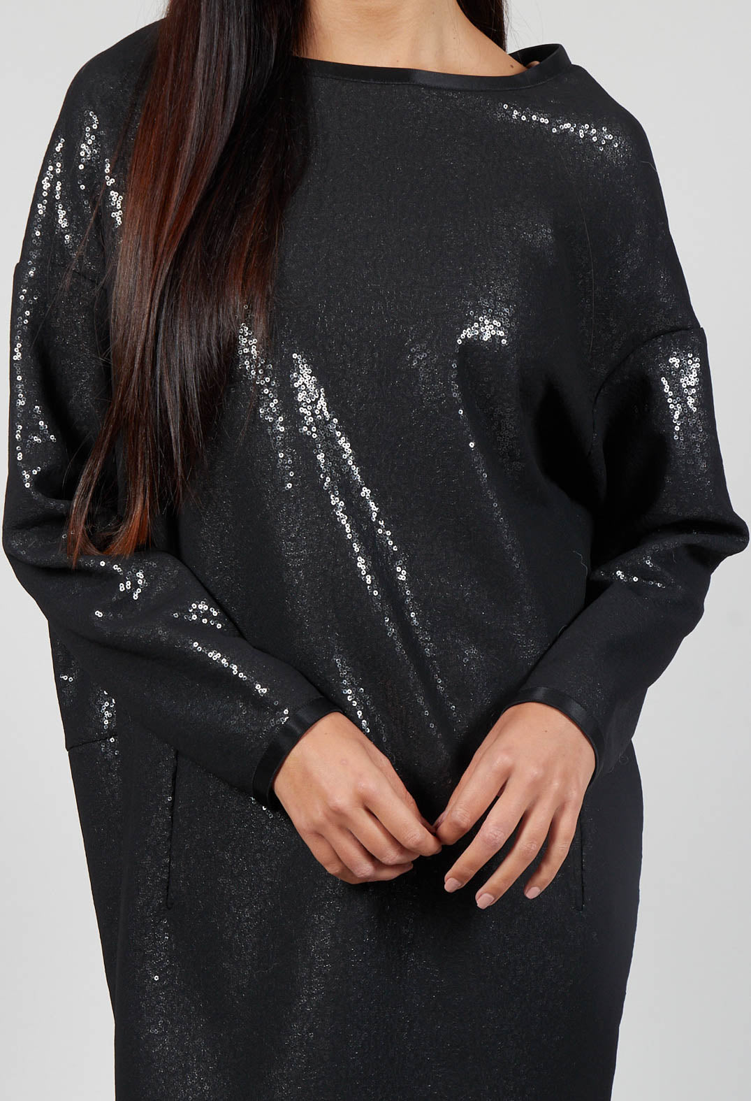 close up of person wearing a vita dress in black sequin