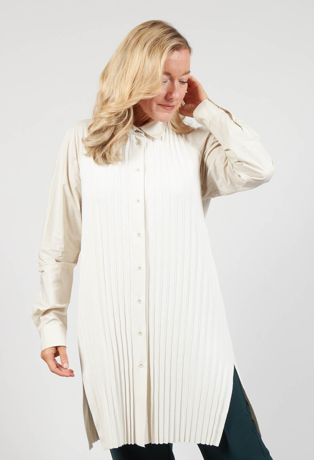 lady wearing a long sleeve blouse in dune shade