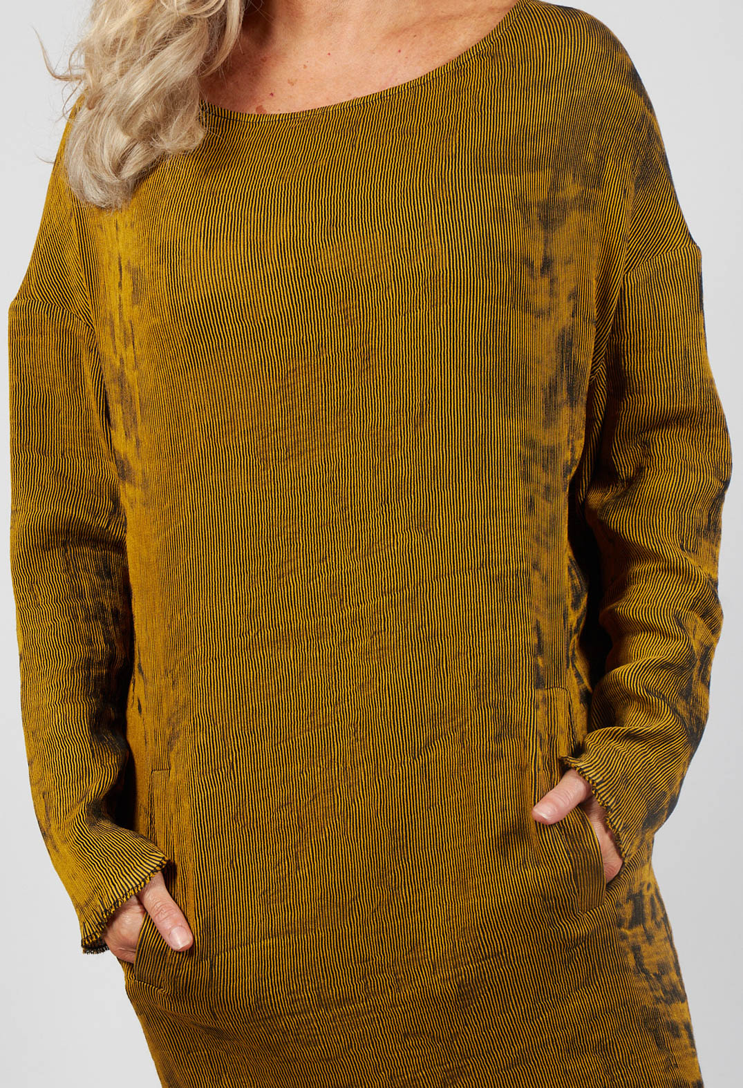 close up of a ladies karim dress in mustard