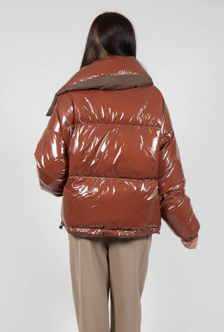 behind shot of lady wearing a brown rao jacket
