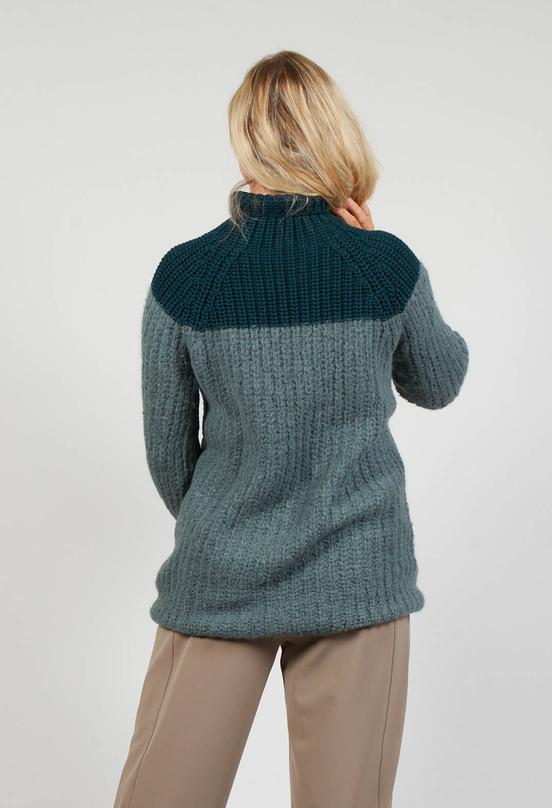 behind shot of ladies knit jumper in cypress green