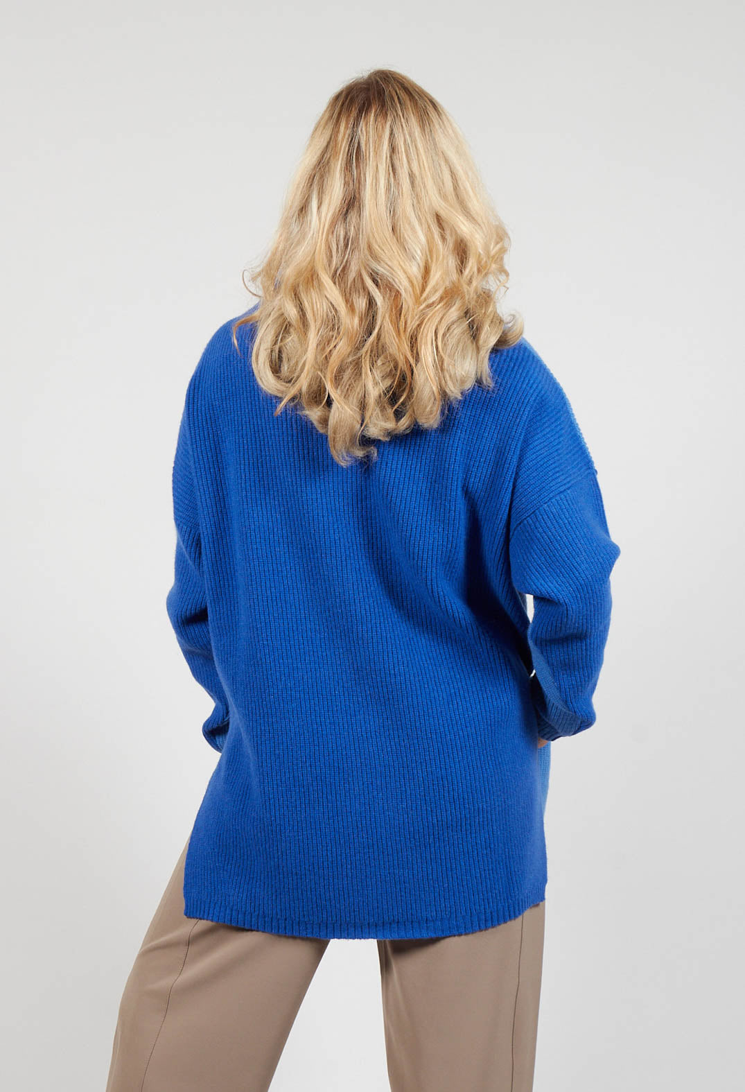 behind shot of a ladies Topaz blue jumper