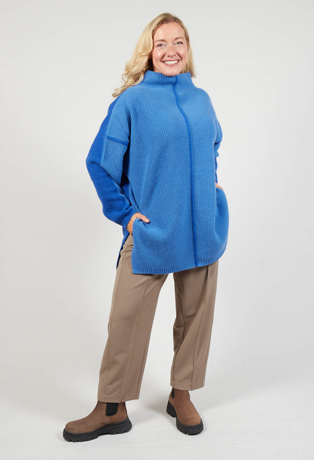 lady wearing a Topaz blue knit jumper