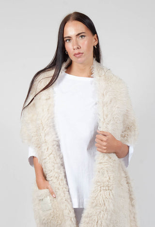 lady wearing a fluffy cream sito scarf