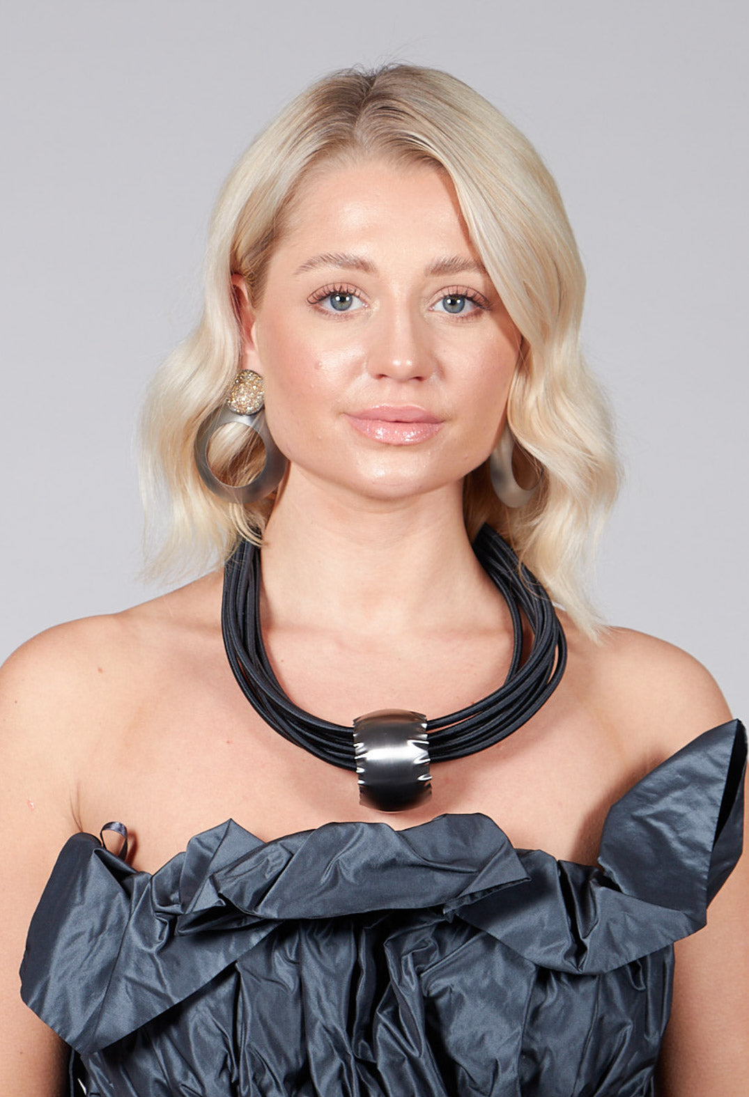 Multistrand Necklace in Black With Silver Metal Pendant