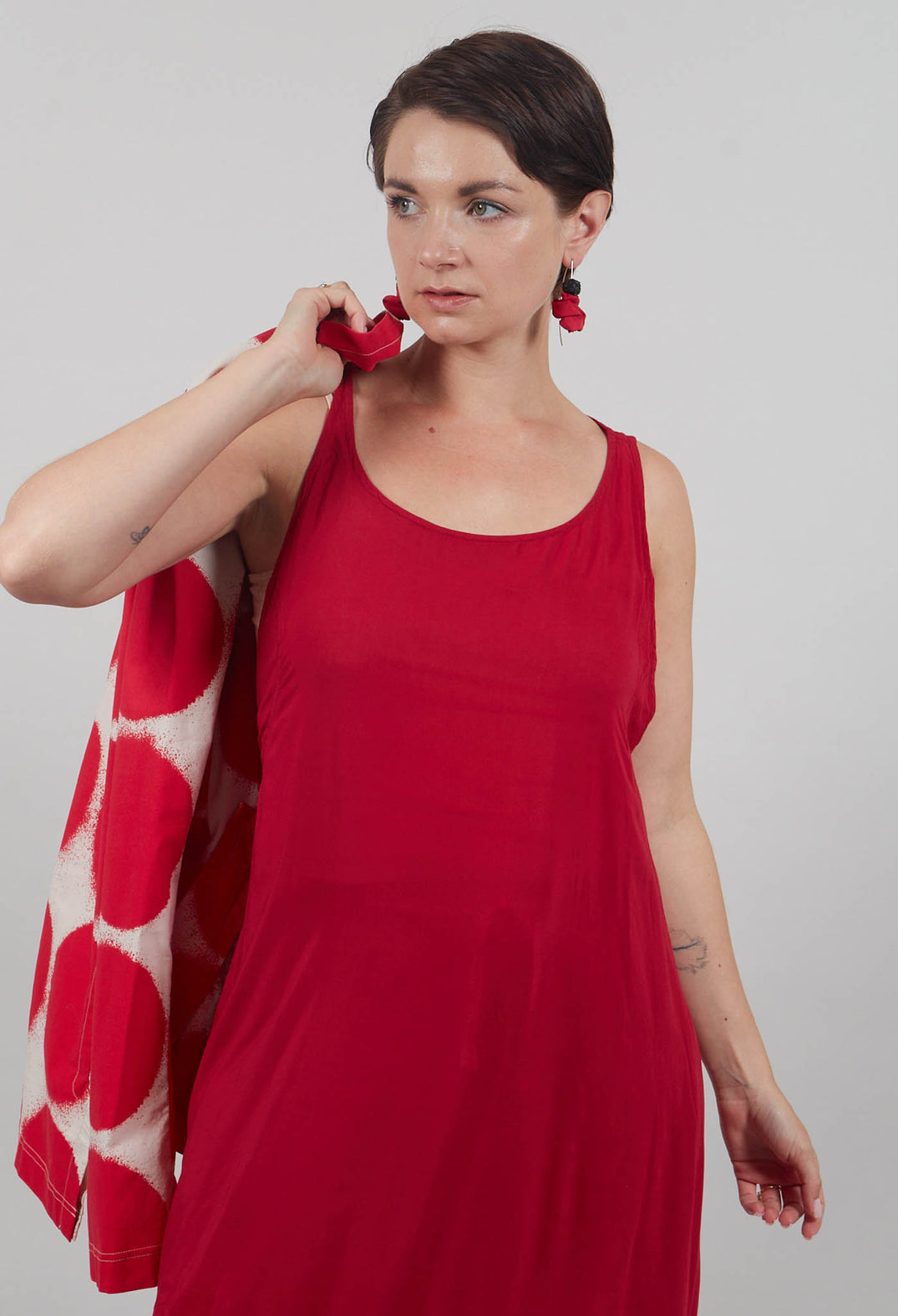 Sleeveless Jersey Dress with Asymmetric Hem in Chili