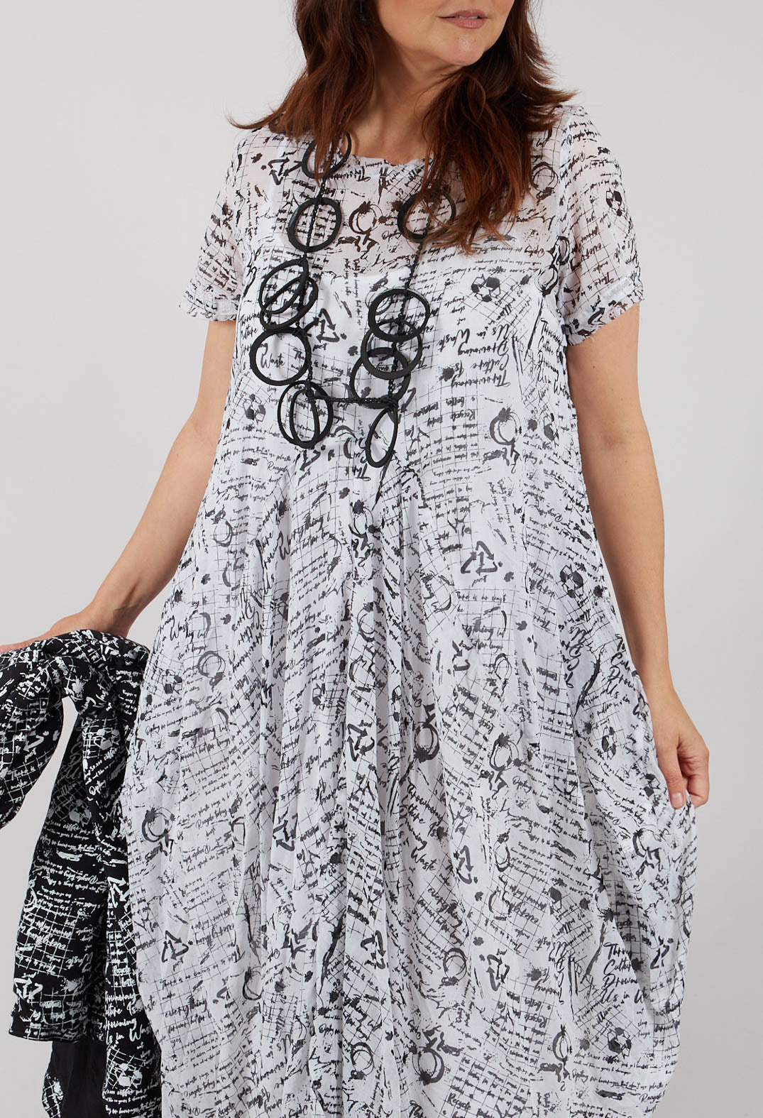 Handkerchief Hem Dress in White with Black Seregraphy