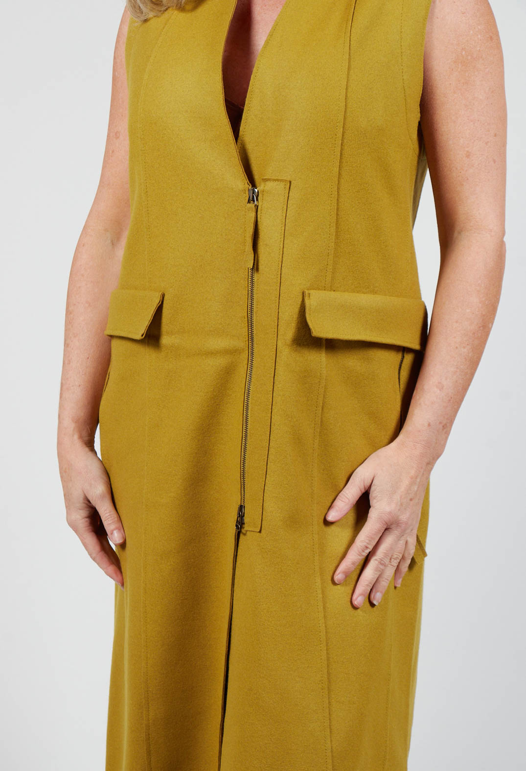 close up of campo vest in mustard