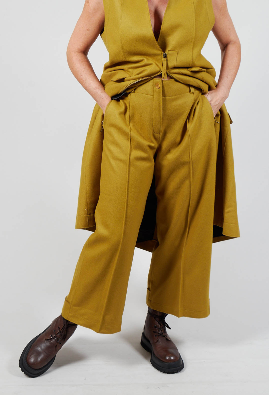 medium shot of mustard carmi ladies trousers with side pockets and button fastening