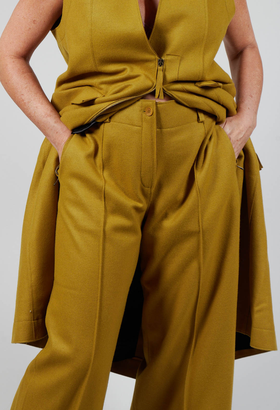 person wearing cumin carmi ladies trousers with their hands in the side pockets