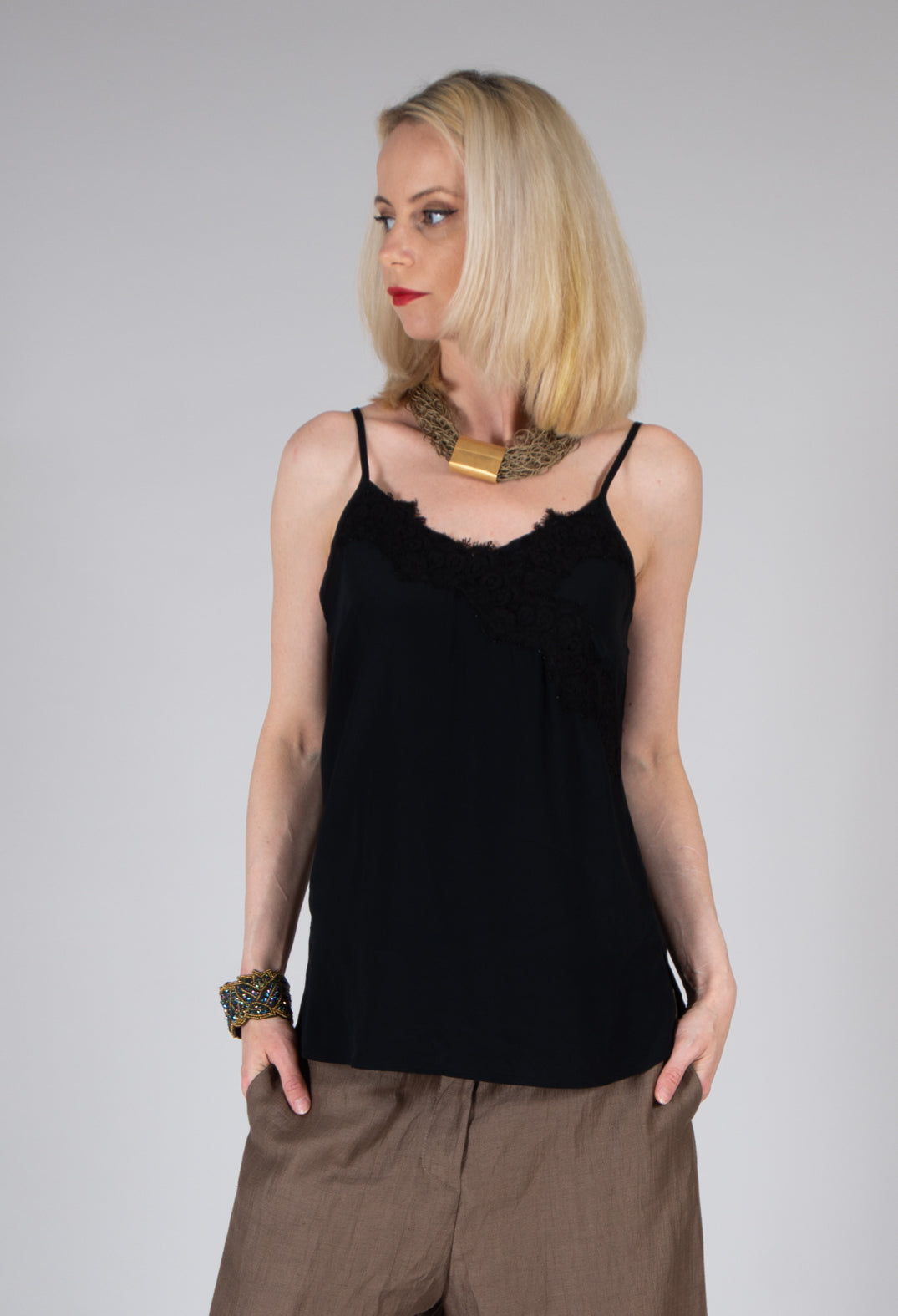 lady wearing a lace cami top in black