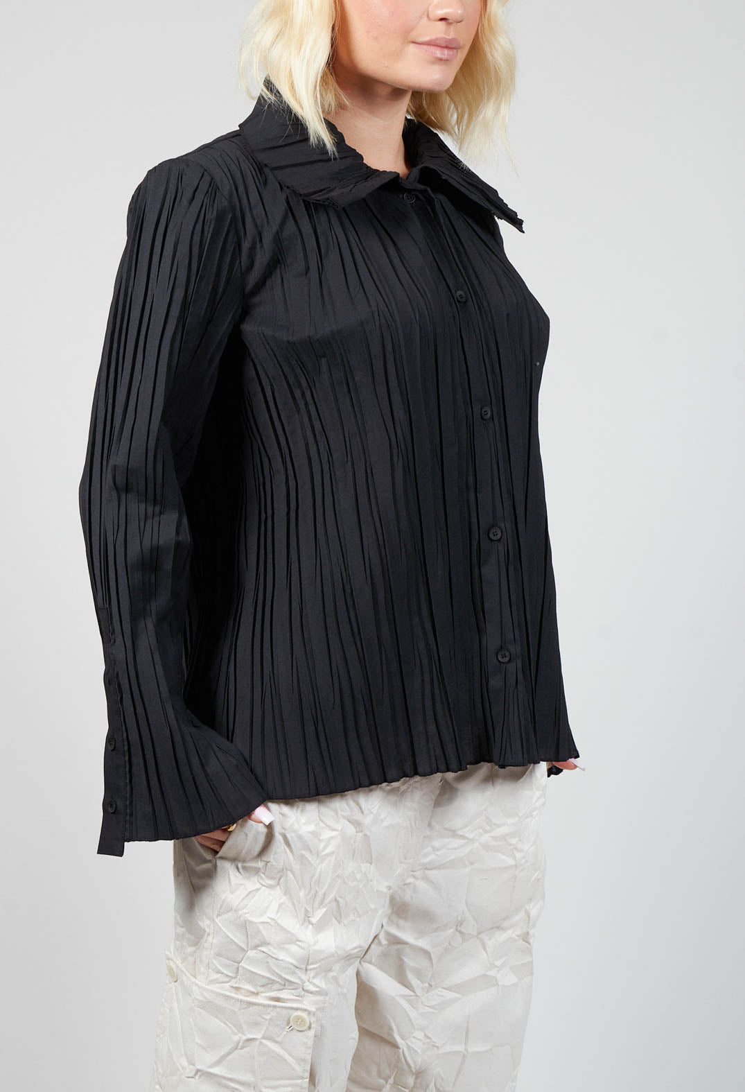 ladies smart black blouse with long sleeves and button sleeves