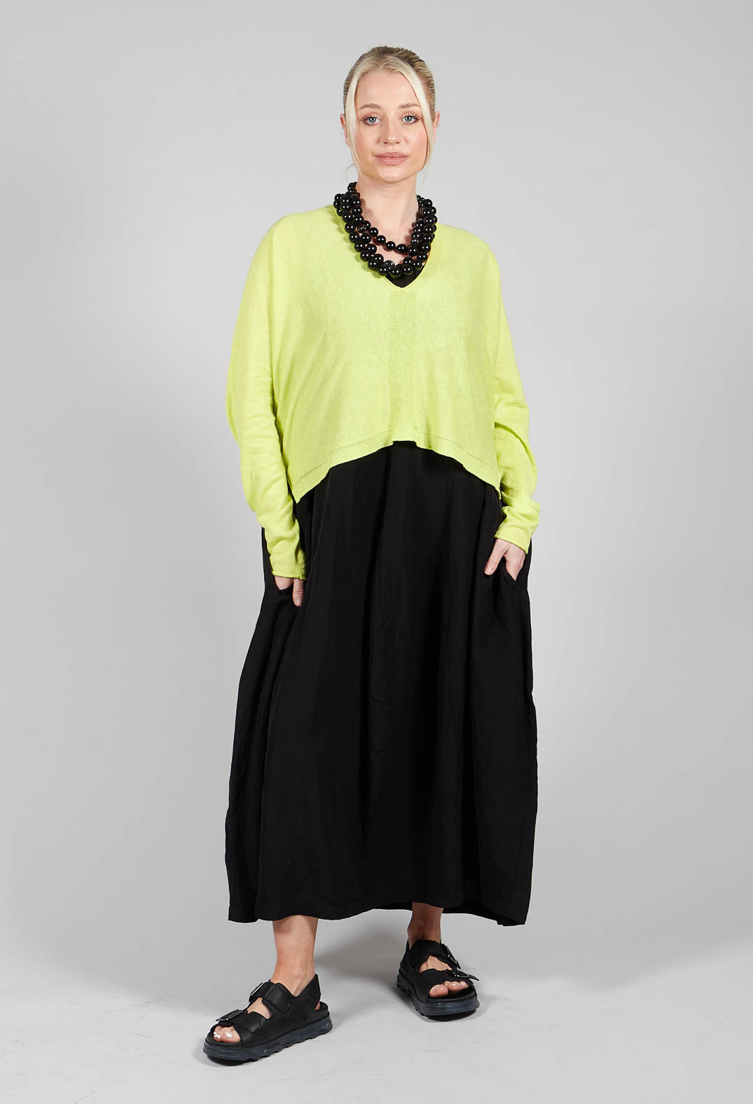 Sleeveless Tulip Hem Dress in Black