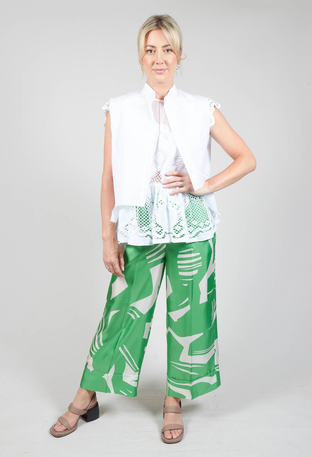 lady wearing green wide leg silk trousers