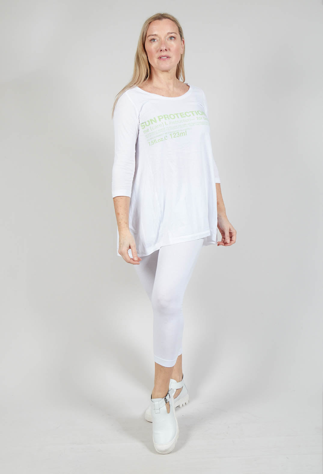 Flared Hem Jersey Top with Motif in Lime Print