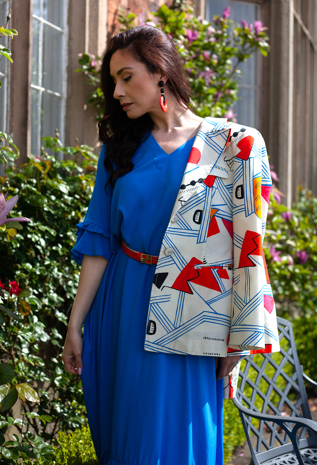 lady wearing a matisse print jacket over the shoulder 