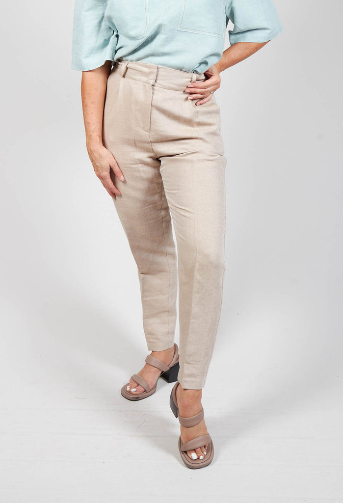 lady wearing tailored trousers in beige