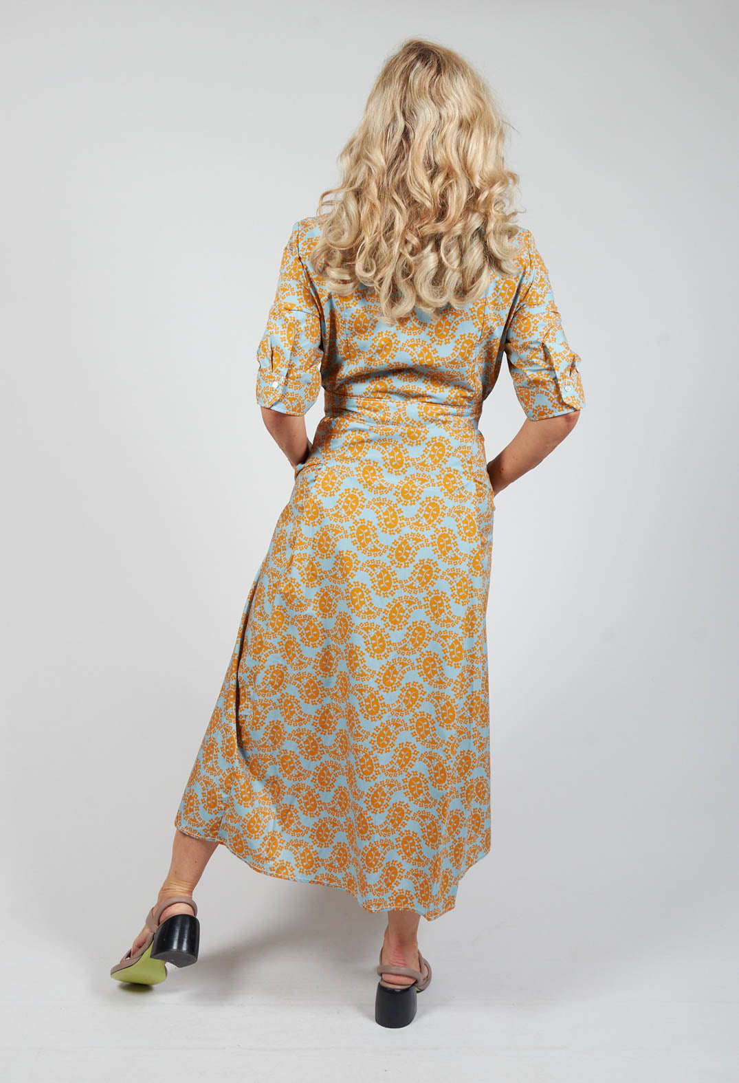 behind shot of Beatrice B shirt dress in mustard