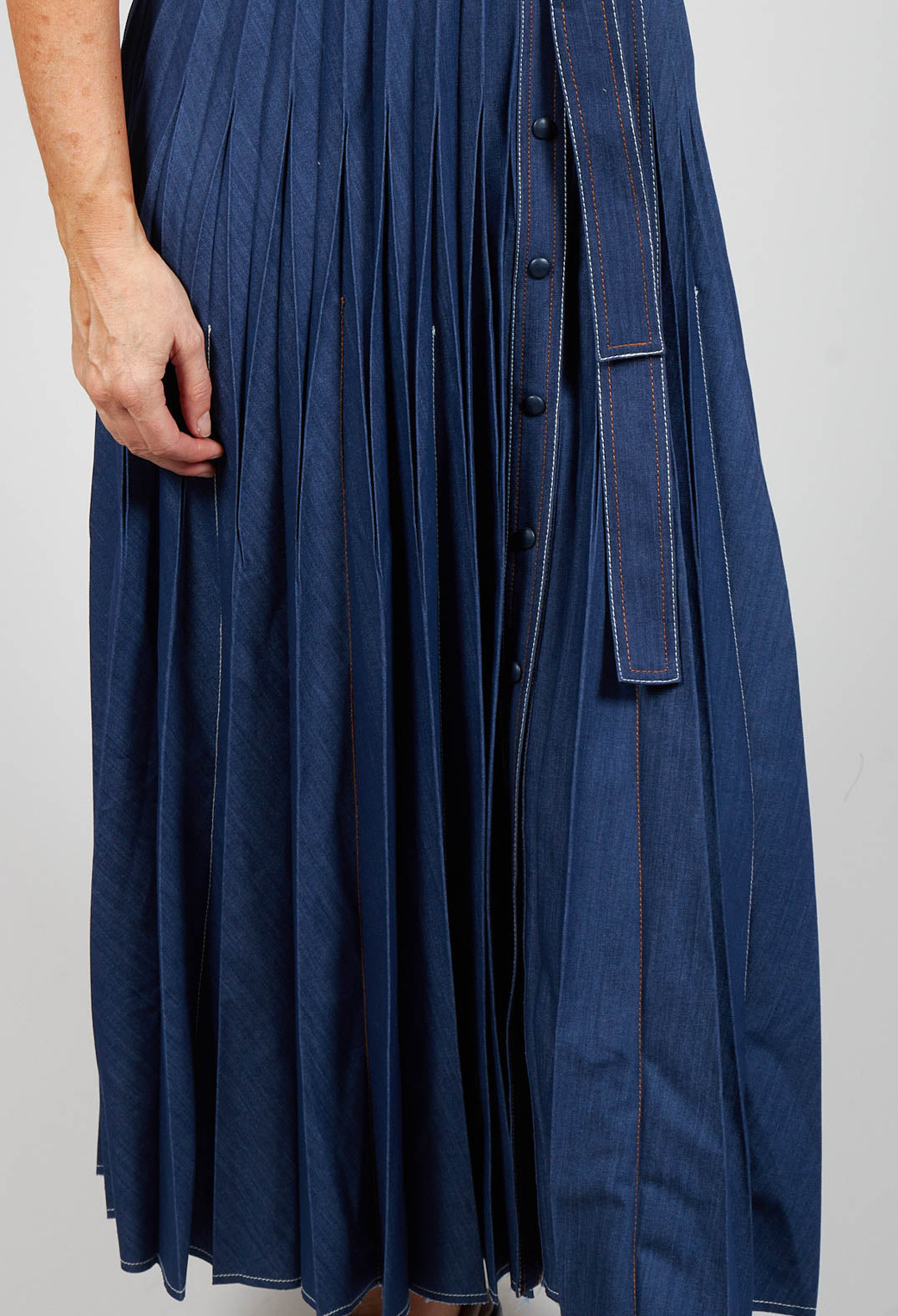 pleated dress detailing at the bottom