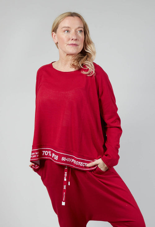 Jumper with Hemline Lettering in Chili Jacquard